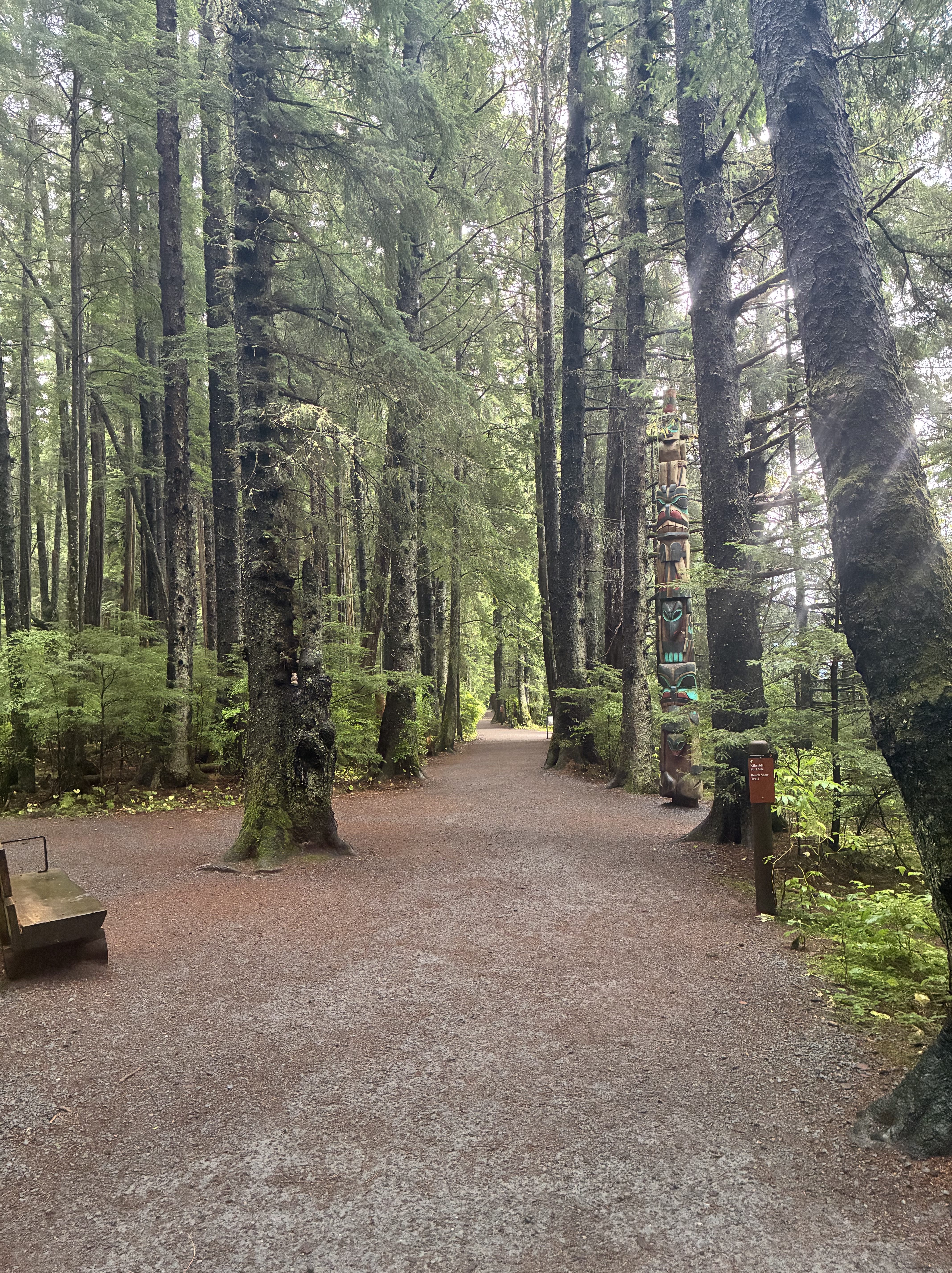 Forest path with a totem pole